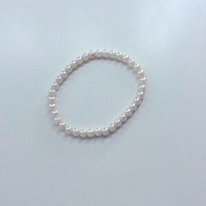 I’m selling one poppet, nine gems and one bracelet and one sticker